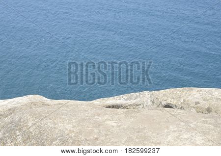 Stone over the Atlantic ocean from the Mountain of Facho in Cangas in the province of Pontevedra Galicia Spain.