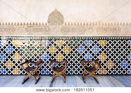 Vintage Traditional Chairs In The Court Of The Myrtles, Alhambra Palace, Granada, Spain