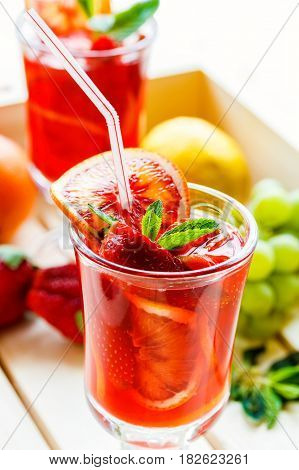 Fruit and berry non-alcoholic cocktail in a wooden box