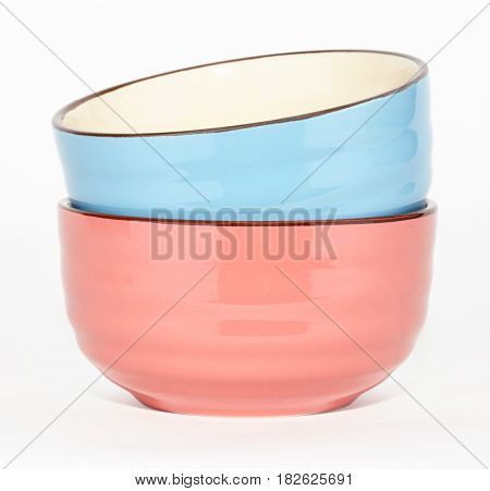 set of colorful ceramic bowls isolated on white background