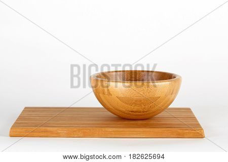Wooden bowl isolated on white background. Board