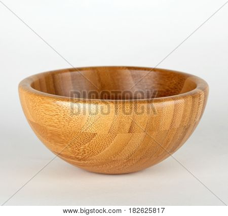 Wooden bowl on white background. Brown bowl