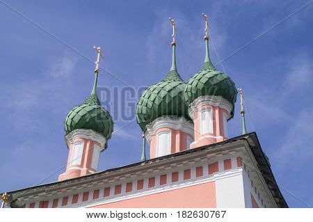 Domes of Beautiful Russian Pink Christian Church in Kostroma blue sky