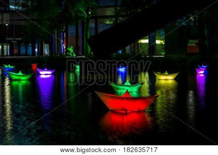 BERLIN - OCTOBER 08 2016: Festival of lights. Installation of luminous ships on the water. Potsdamer Platz.