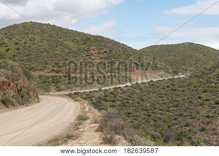 CALITZDORP SOUTH AFRICA - MARCH 24 2017: The road between Kruisrivier and Calitzdorp as seen from the Calitzdorp Dam viewpoint