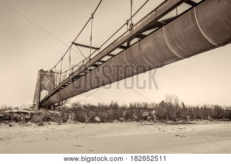 Great Western Sugar Company Effluent Flume and Bridge - rusty abandoned flume was used to transport factory waste across the Poudre River in Fort Collins, platinum toned image