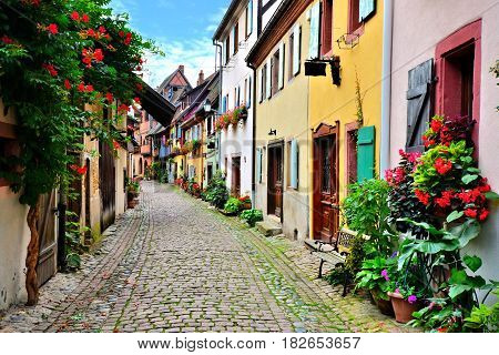 Picturesque Street In The Of The Town Of Eguisheim, Alsace, France