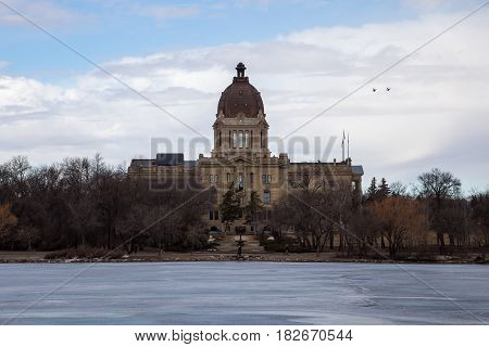 The Saskatchewan Legislative building as seen from the shore of Wascana Lake in Regina Saskatchewan.