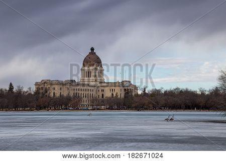 The Saskatchewan Legislative building as seen from the shore of Wascana Lake in Regina Saskatchewan.