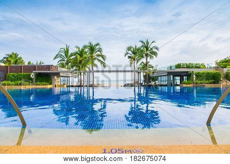 Swimming pool neary sand and sea