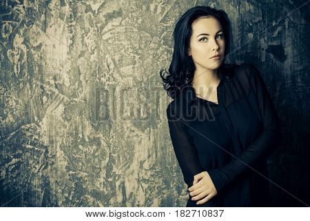 Portrait of a beautiful young woman with brunette hair. Beauty, fashion concept. Cosmetics.