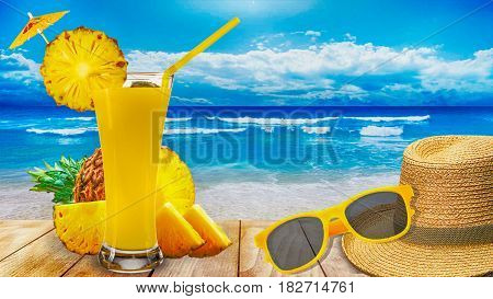 pineapple juice glass pineapple and slices on wooden beach table in sea shore