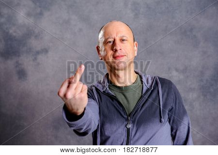 Baldheaded Man Showing Middle Finger