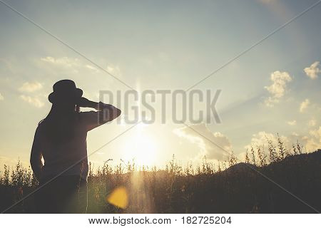Asian hipster cute teen girl enjoying sunset on peak. Tourist traveler on background valley landscape view mock-up sunset in trip in basque country.