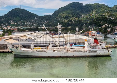 Victoria Mahe island Seychelles - December 17 2015: Reefer ship Platte Reefer in import export and business logistic at the harbor of Port Victoria Mahe island Seychelles Indian Ocean East Africa.