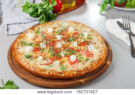 Four Cheese Pizza Quattro Fromaggi On A Rustic Wooden Board On The Table With Ingridients. Selective