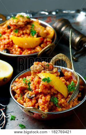 lemony chicken stew giant couscous.. selective focus