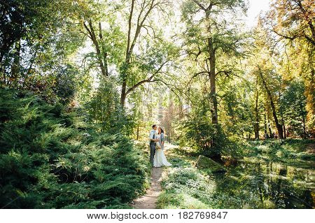 Happy Couple Walking In Summer Park