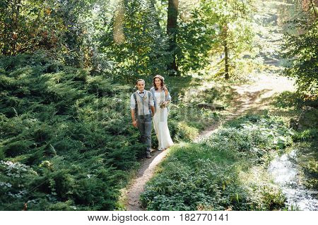 Happy Couple Walking In Summer Park