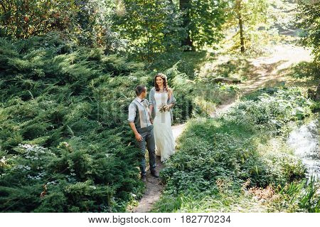 Happy Couple Walking In Summer Park