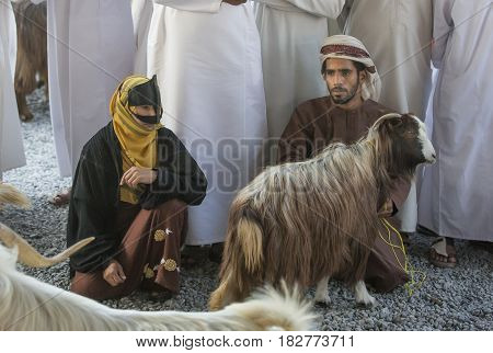 Omani Couple With A Goat