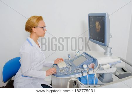 Doctor Analyze The Result Of Ultrasound Diagnostic Machine