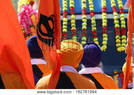 Sikh Men With Flags During Festival On The Road