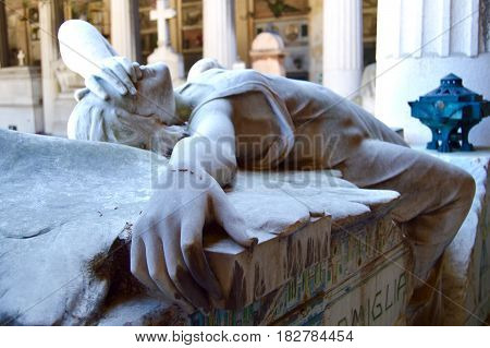 The beauty of despair seen through a cemetery statue