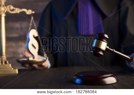 Mallet in the hand of the judge. Law concept.