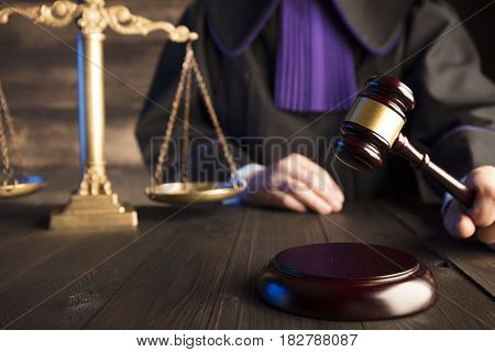 Mallet in the hand of the judge. Law concept.