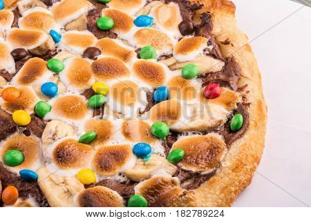 Dessert pizza with chocolate nuttely and air to a marshmello