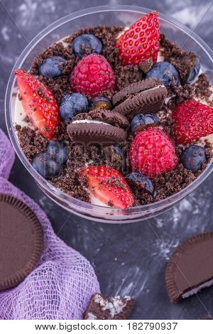 A fruit dessert with mascarpone cheese and cookies