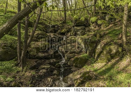 Waterfall near Moravany village in spring green day