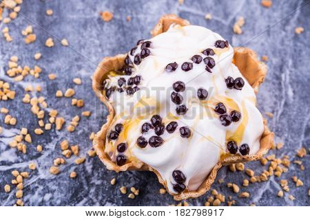 Ice cream with lemon jam, is served with chocolate balls