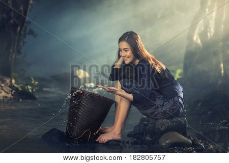 Asian sexy woman working at streams, Countryside of Thailand