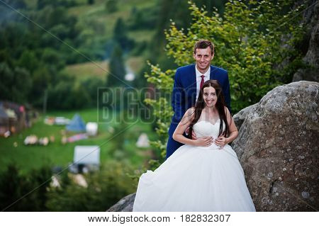Lovely Wedding Couple Against Rocks Of Fortess Tustan At Carpathian Mountains.
