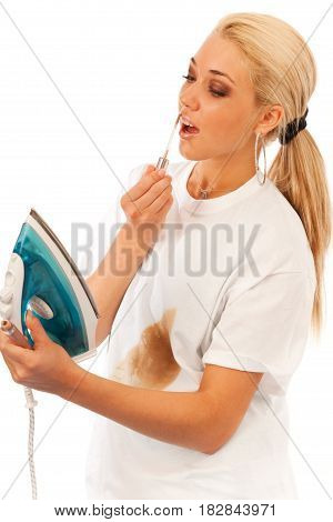 young blond woman fails ironing her tshirt and finds a better use for that shiny thingy.