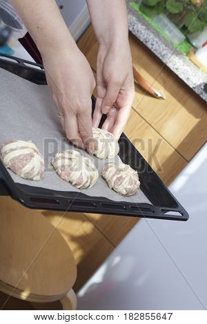 Stages Of Preparation Of Meat Glomeruli. The Blanks Are Laid Out On A Baking Tray Lined With Food Pa