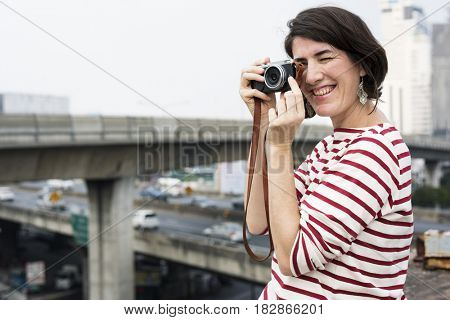 Woman traveler photographer holiday lifestyle trip