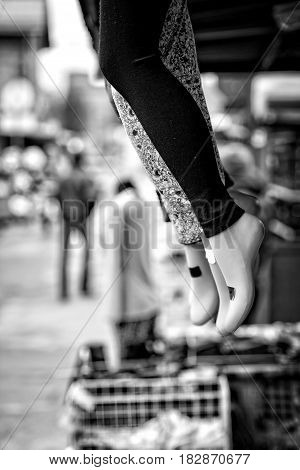 At outlets located mannequin legs with goods samples.