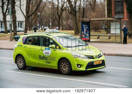 Riga, Latvia - December 13, 2016: Toyota Verso Car From Baltic Taxi Moving On Kalpaka Boulevard Street In Riga, Latvia