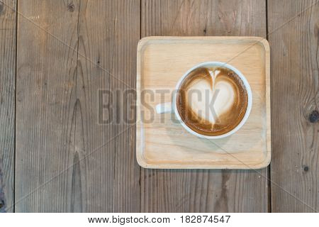 top view of clean hot cappuccino coffee on wood table