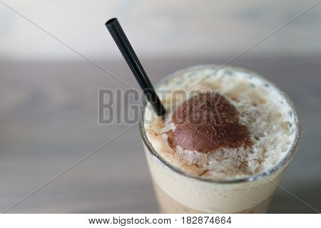 close up top view ice cappuccino milk glass with it topping