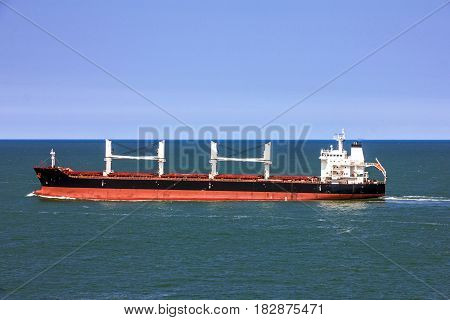 Cargo bulker ship sailing in sea, transport