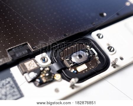 Chiang Rai Thailand: April 8 2017 - Close-up image of backside of Apple iPhone 6 6 Plus 6s and 6s Plus Touch ID fingerprint scanner and Home button module. Selective focus