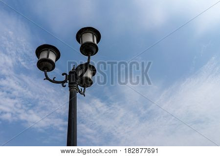 Vintage classic street light lamp decoration with clear blue sky