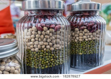 Vaious of beans and peas green red and black sesame protein in the jars