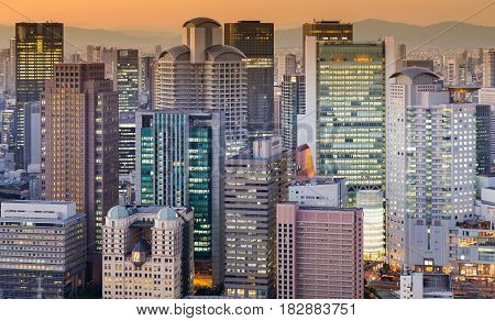 Office building city light sunset tone cityscape downtown background Osaka Japan