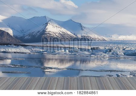 Opening wooden floor Beauty Iceland winter season lagoon and mountain nautral landscape background