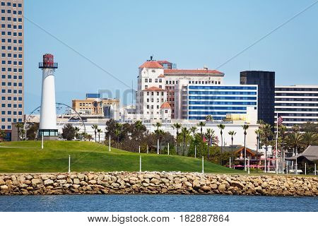 Cityscape of Long Beach with lighthouse, high-risers, skyscrapers and palm trees, USA